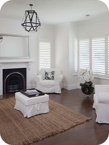 Light feel Hamptons inspired living with fireplace and timber floors