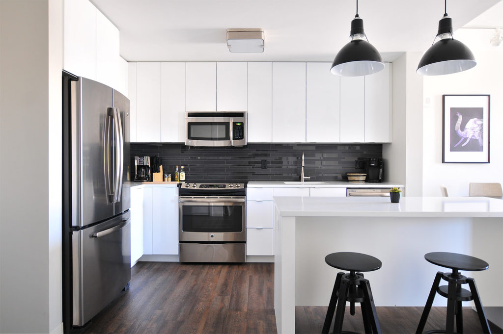Stylish modern kitchen with black splashback