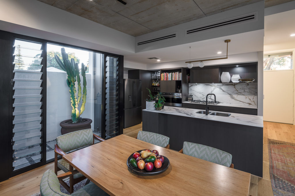 Stylish contemporary style kitchen with marbled splashback