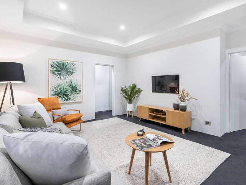 White modern living room with tropical decor